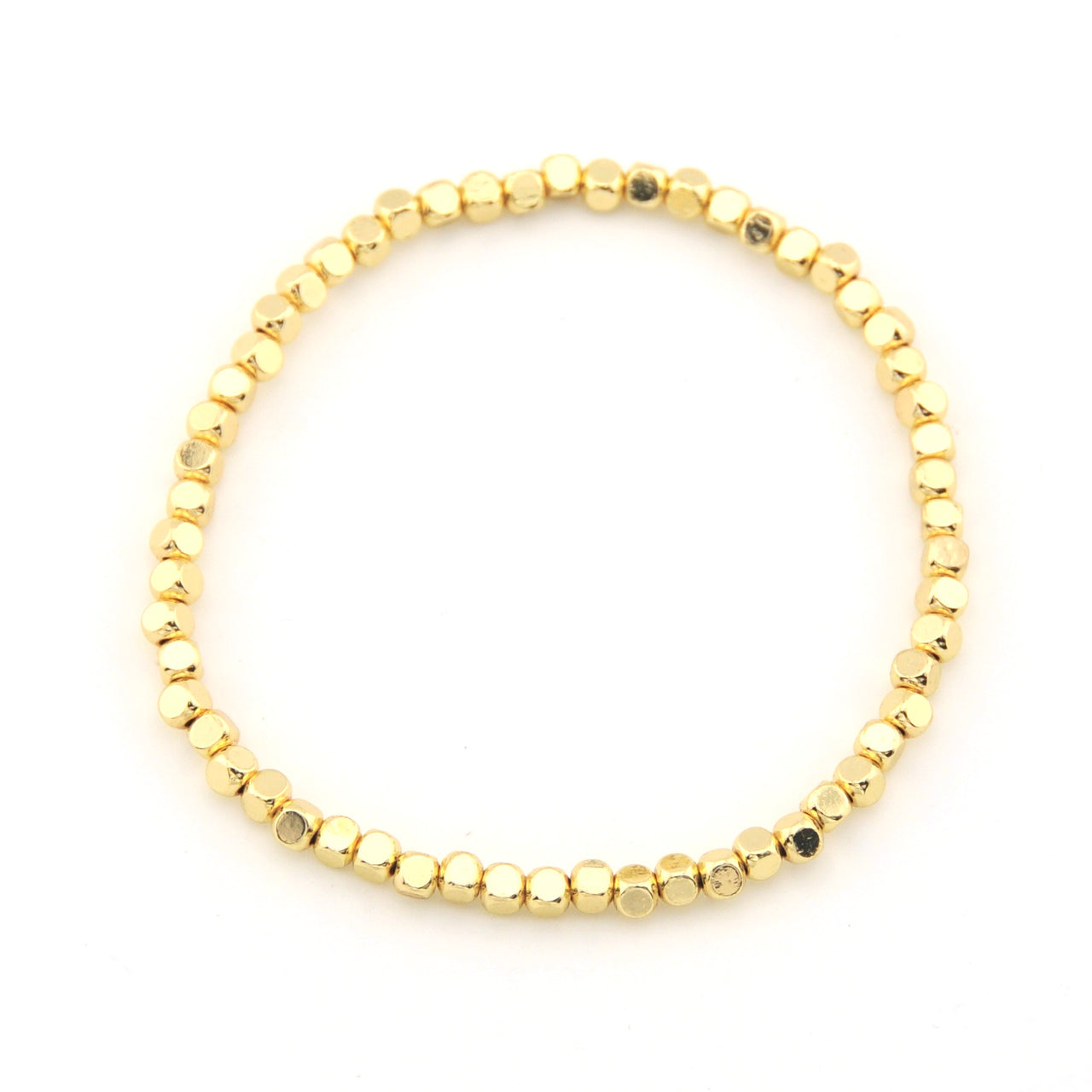 Gold beaded bracelet on a white background