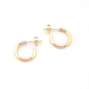 Gold hoop earrings on a white background