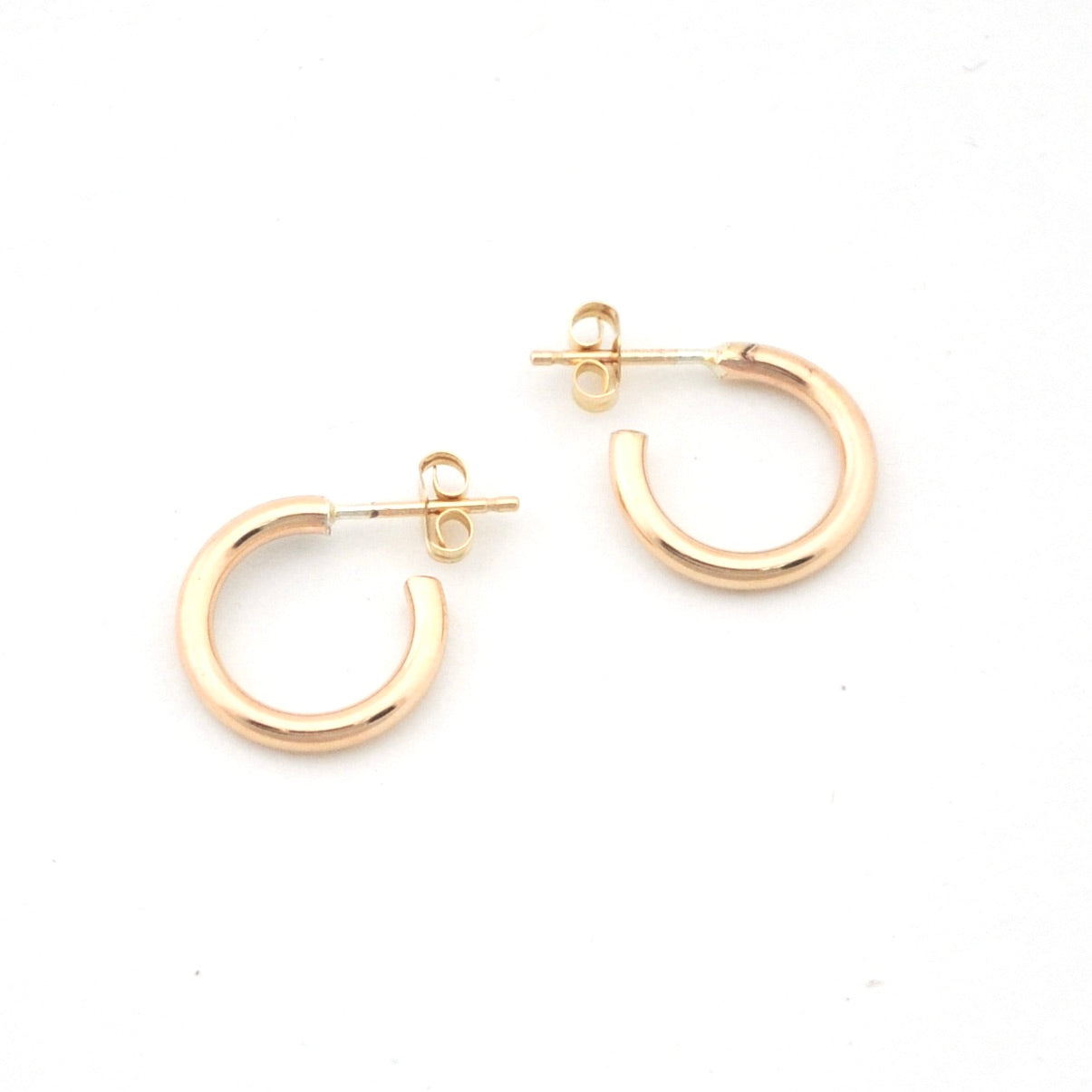 Gold hoop earrings on a white background