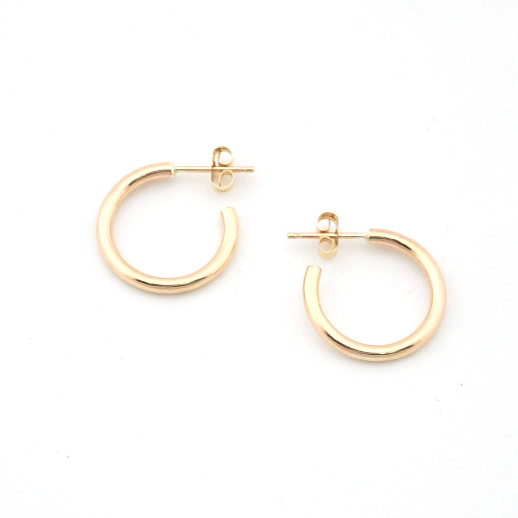 Gold hoop earrings on a white background