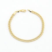 Gold chain bracelet on a white background