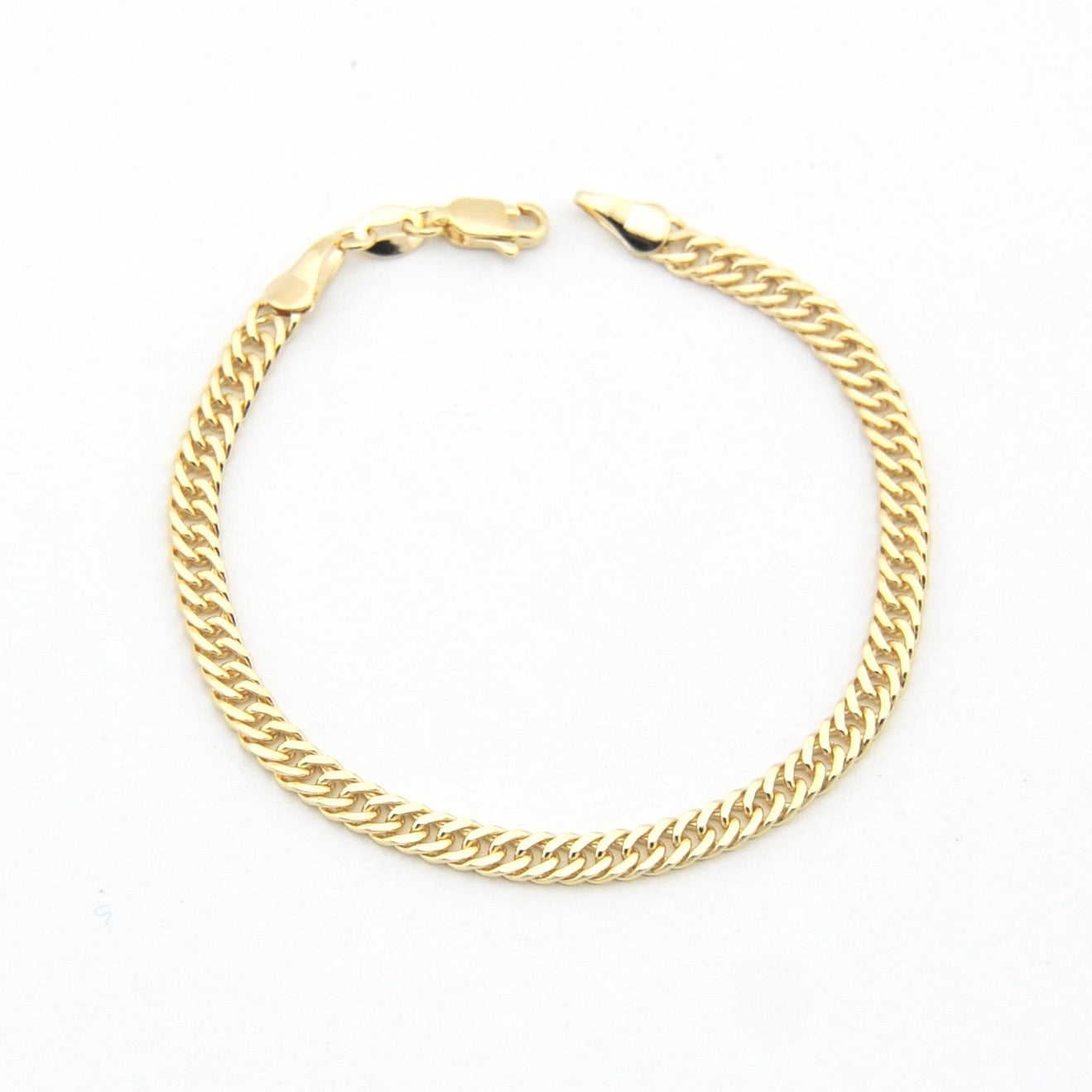 Gold chain bracelet on a white background