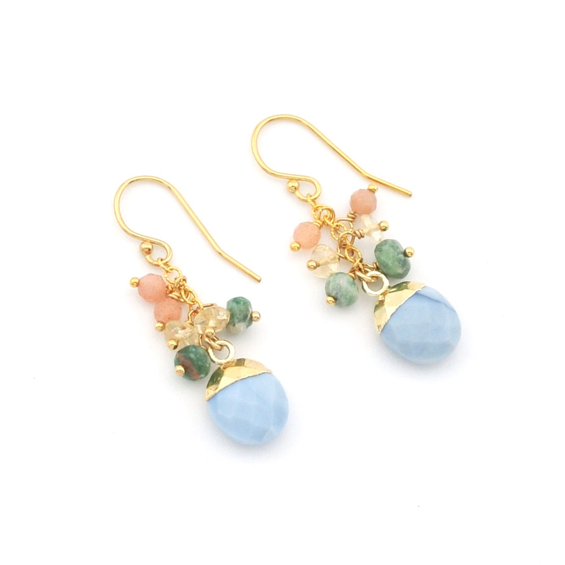 Pair of gold earrings with blue, green, and pink beads on a white background