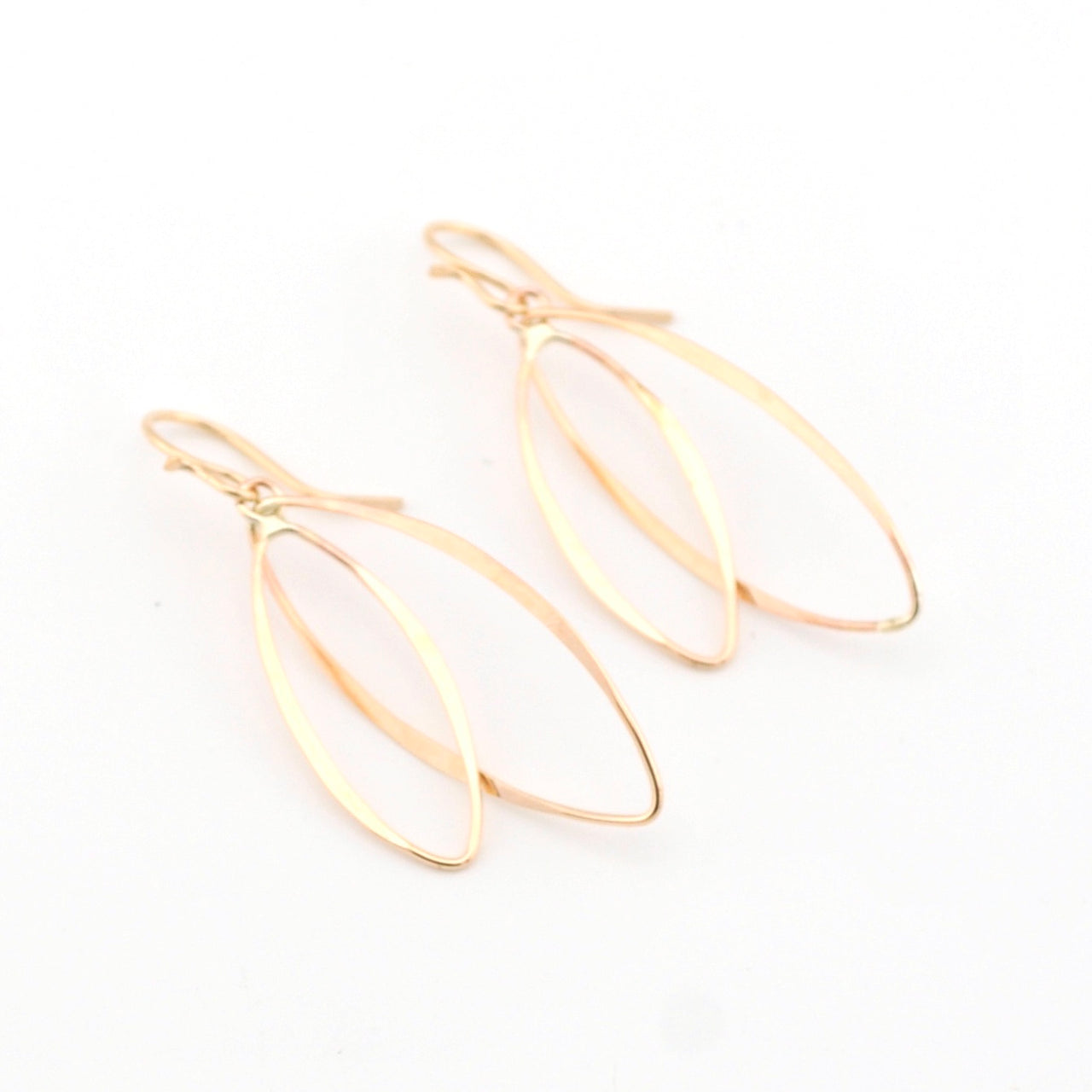 Gold earrings on a white background