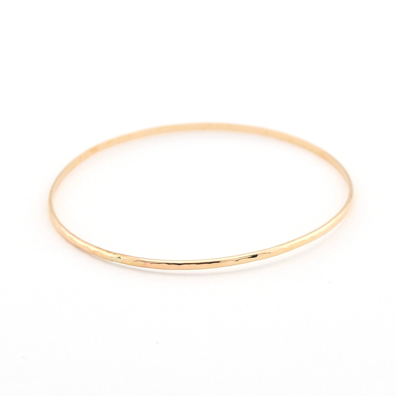 Gold bracelet on a white background