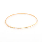 Gold bracelet on a white background