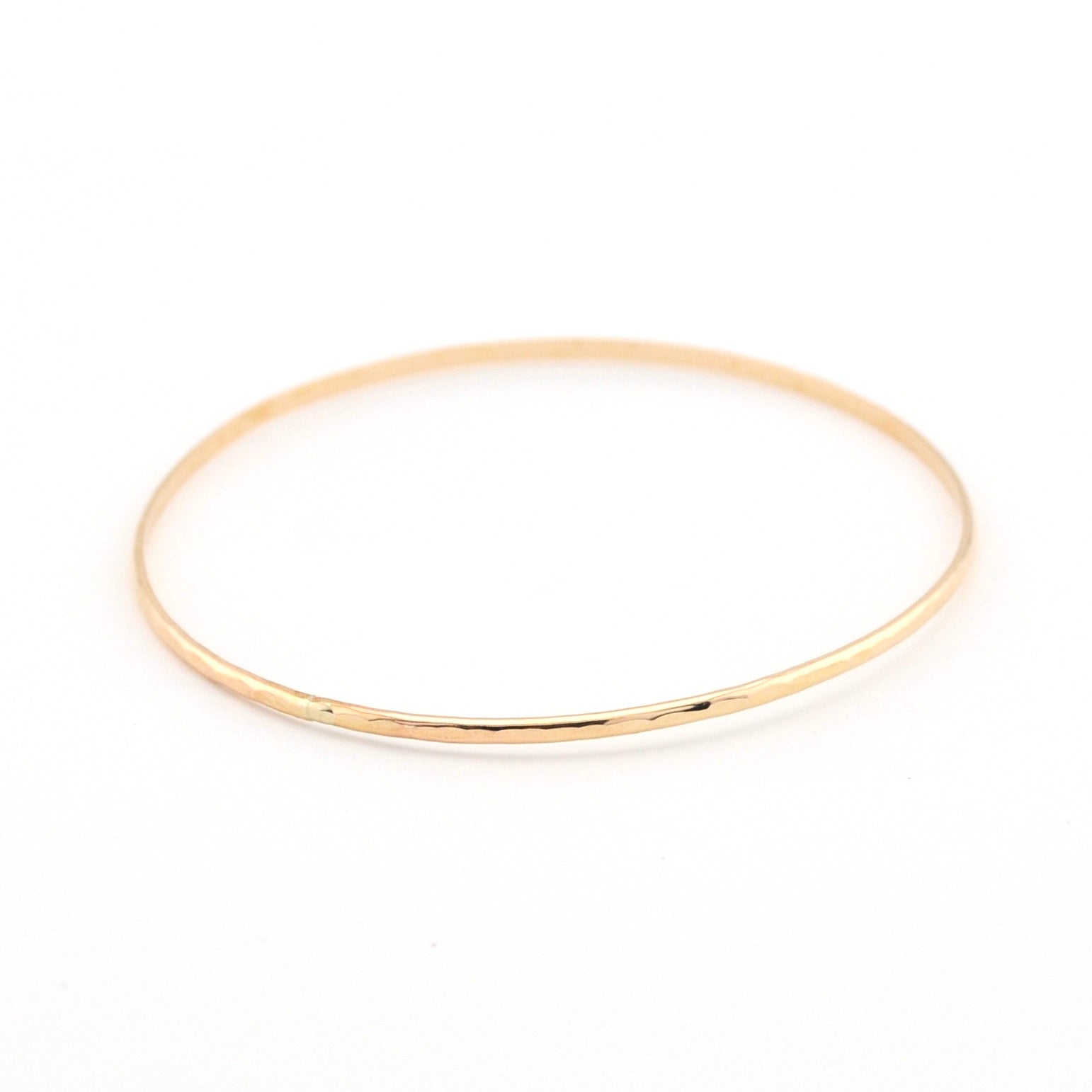 Gold bracelet on a white background