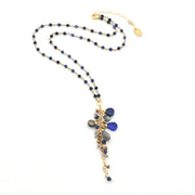 Necklace with blue and gray beads on a white background