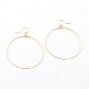 Gold hoop earrings on a white background