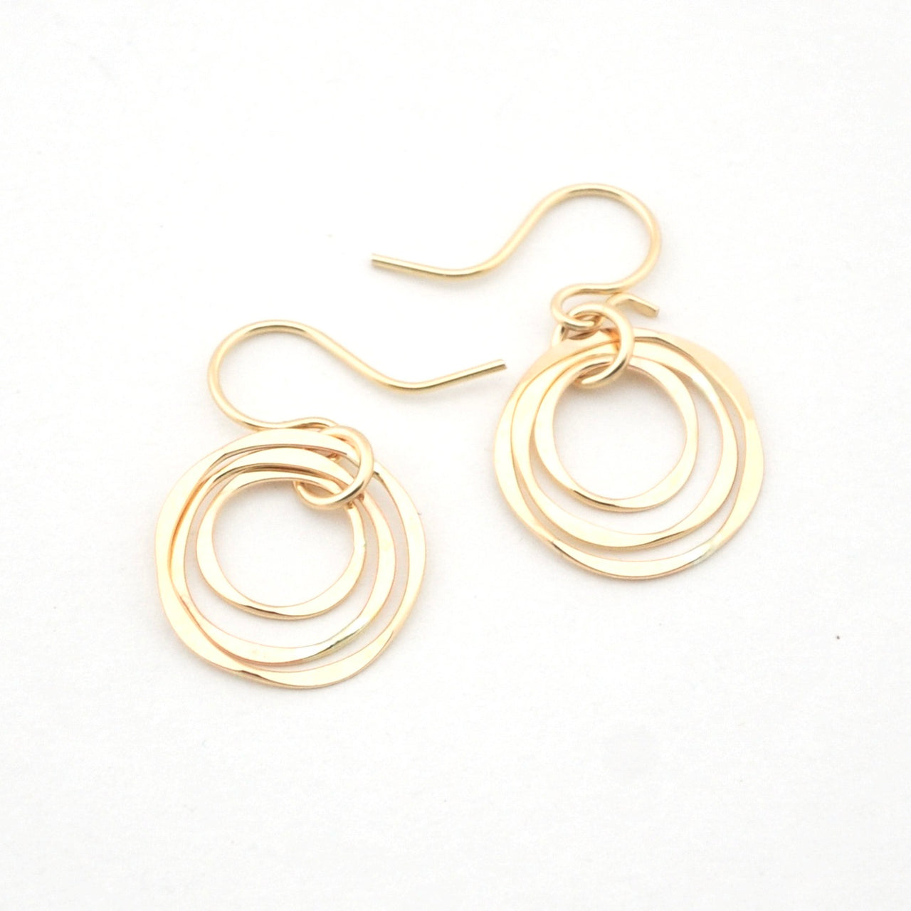 Gold hoop earrings on a white background
