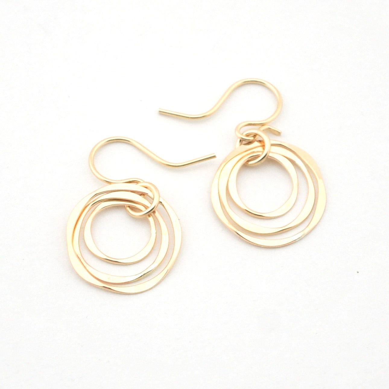 Gold hoop earrings on a white background