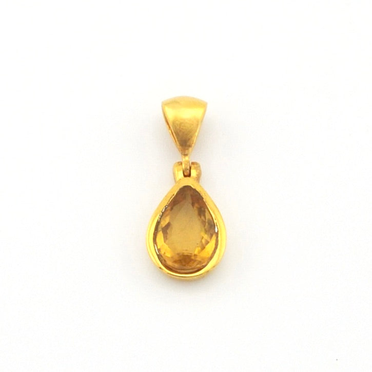 A gold pendant featuring a teardrop-shaped yellow gemstone, shown against a plain white background.