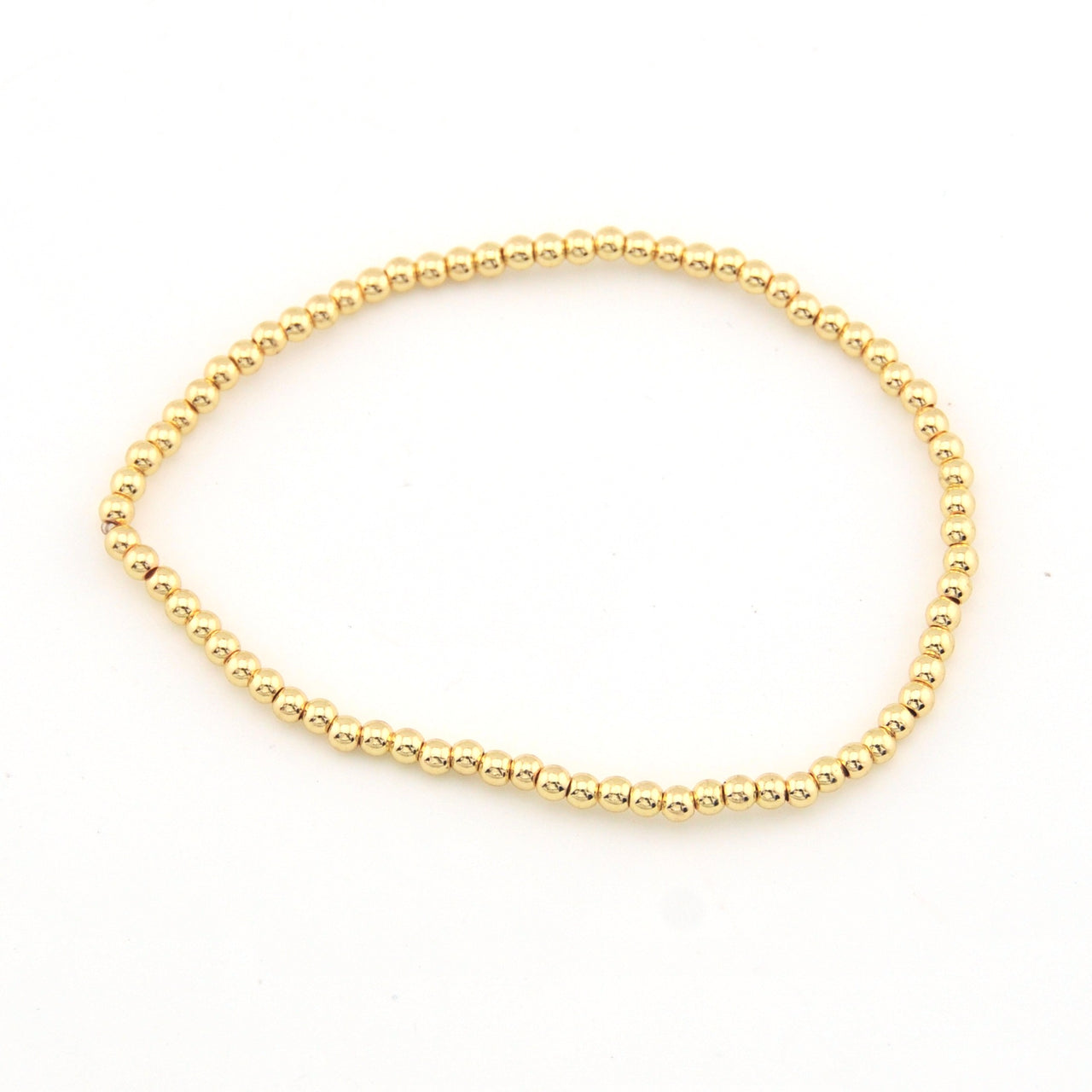 Gold bracelet on a white background