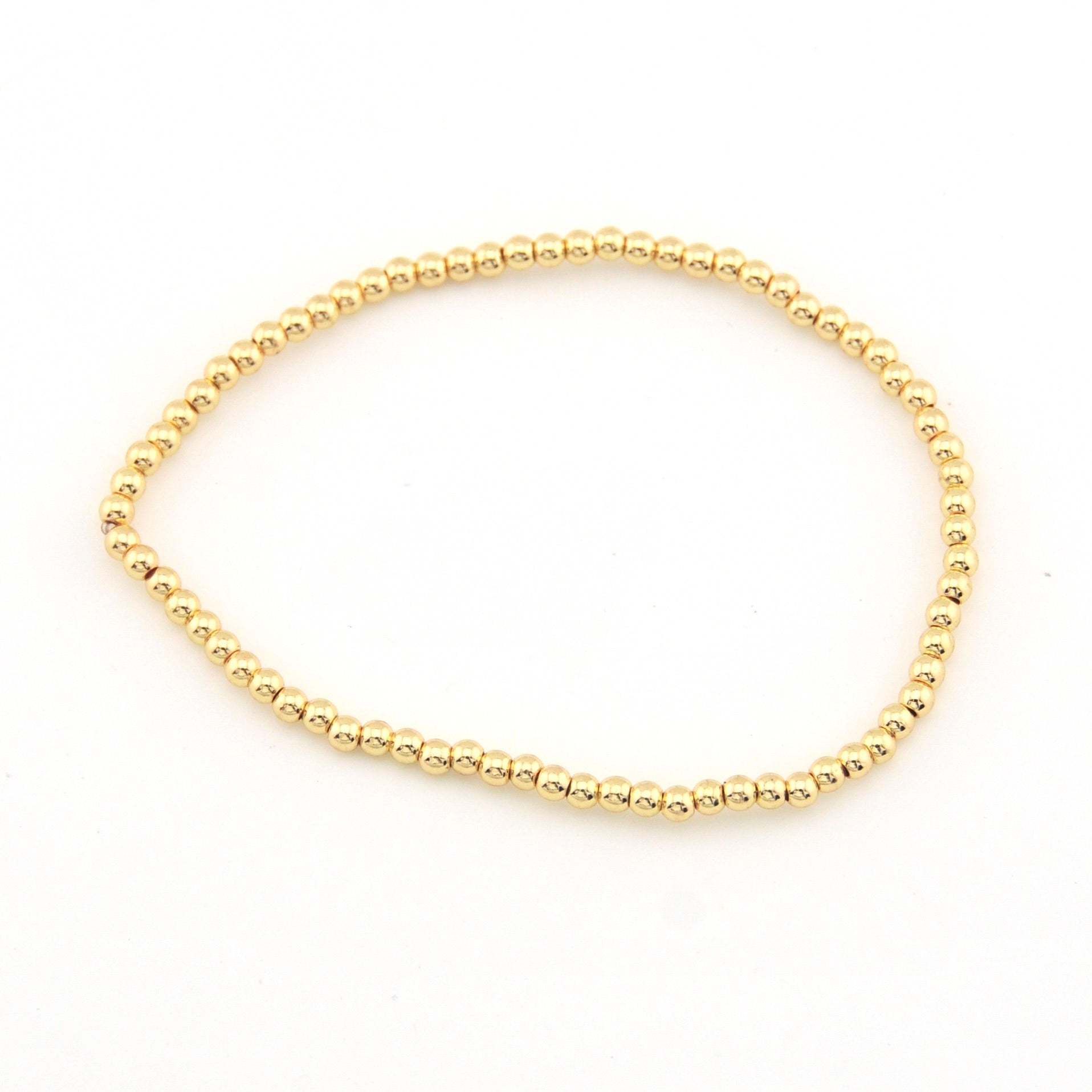 Gold bracelet on a white background