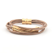 Bracelet with gold accents on a white background