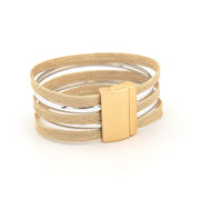Multilayered bracelet with gold and silver bands on a white background