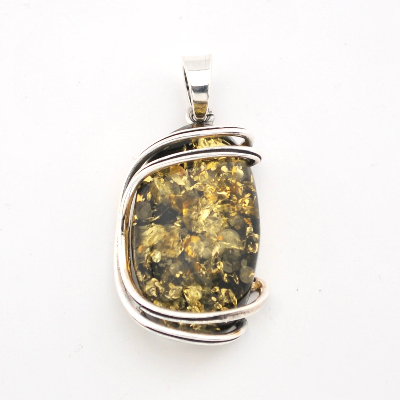 Silver pendant with a large amber stone on a white background