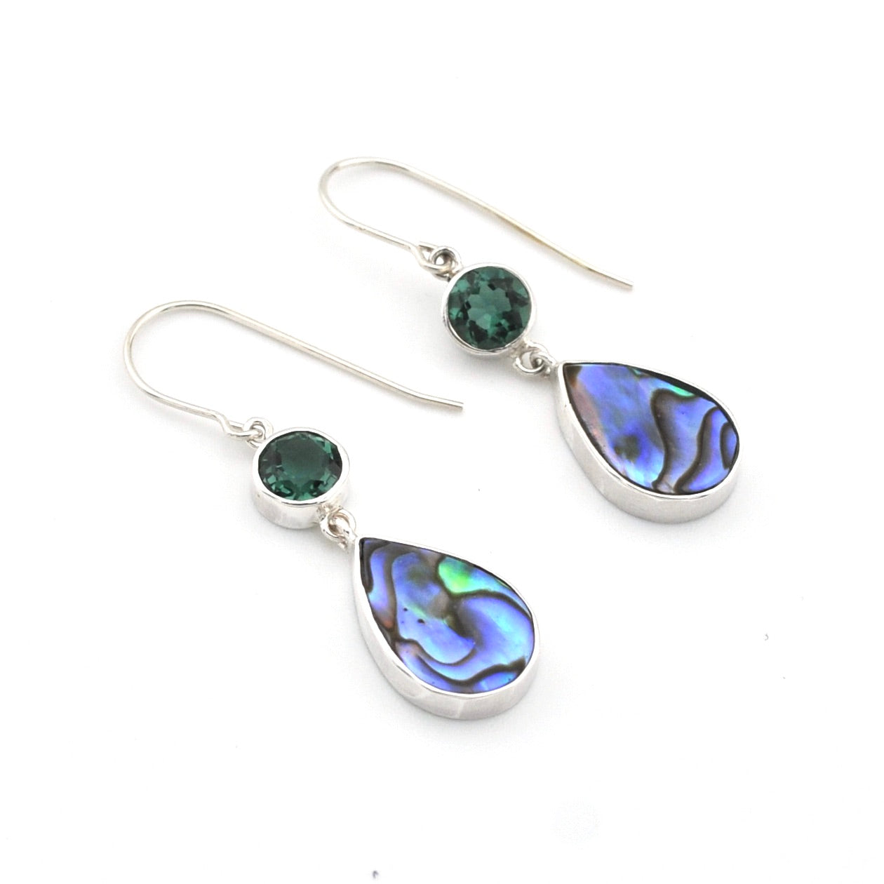 Pair of earrings with teardrop-shaped gemstones on a white background