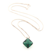 Necklace with a green pendant on a white background