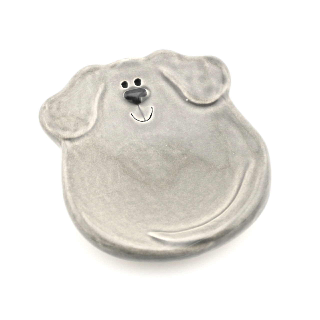 Metallic dog-shaped object on a white background