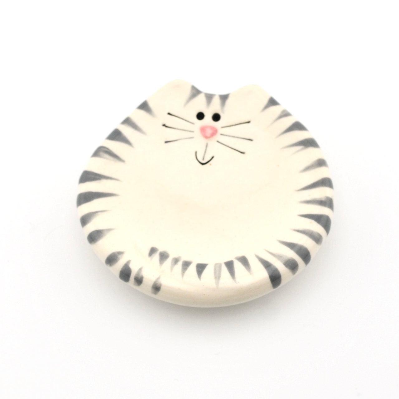 Round ceramic dish with a cat design on a white background