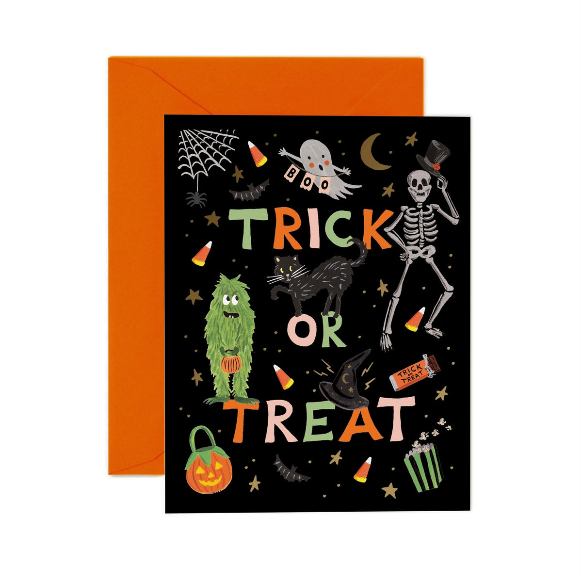 A Halloween greeting card with a black background and colorful 'TRICK OR TREAT' lettering, shown with an orange envelope behind it on a white background.