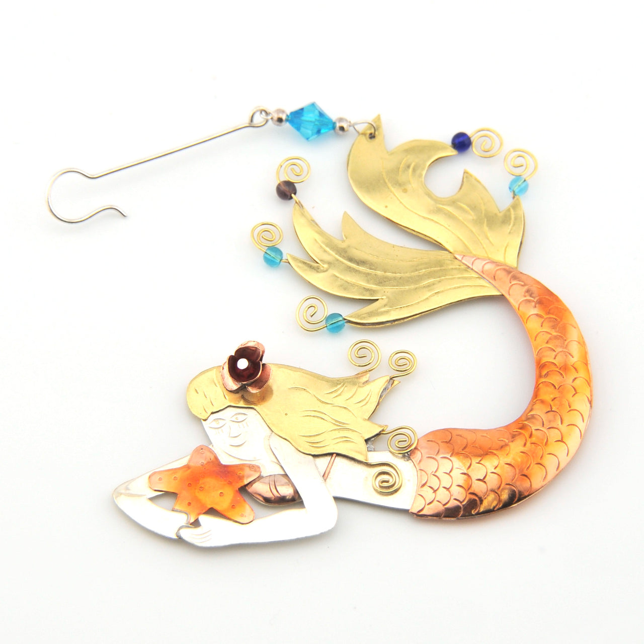 Decorative mermaid ornament with gold and orange tail on a white background