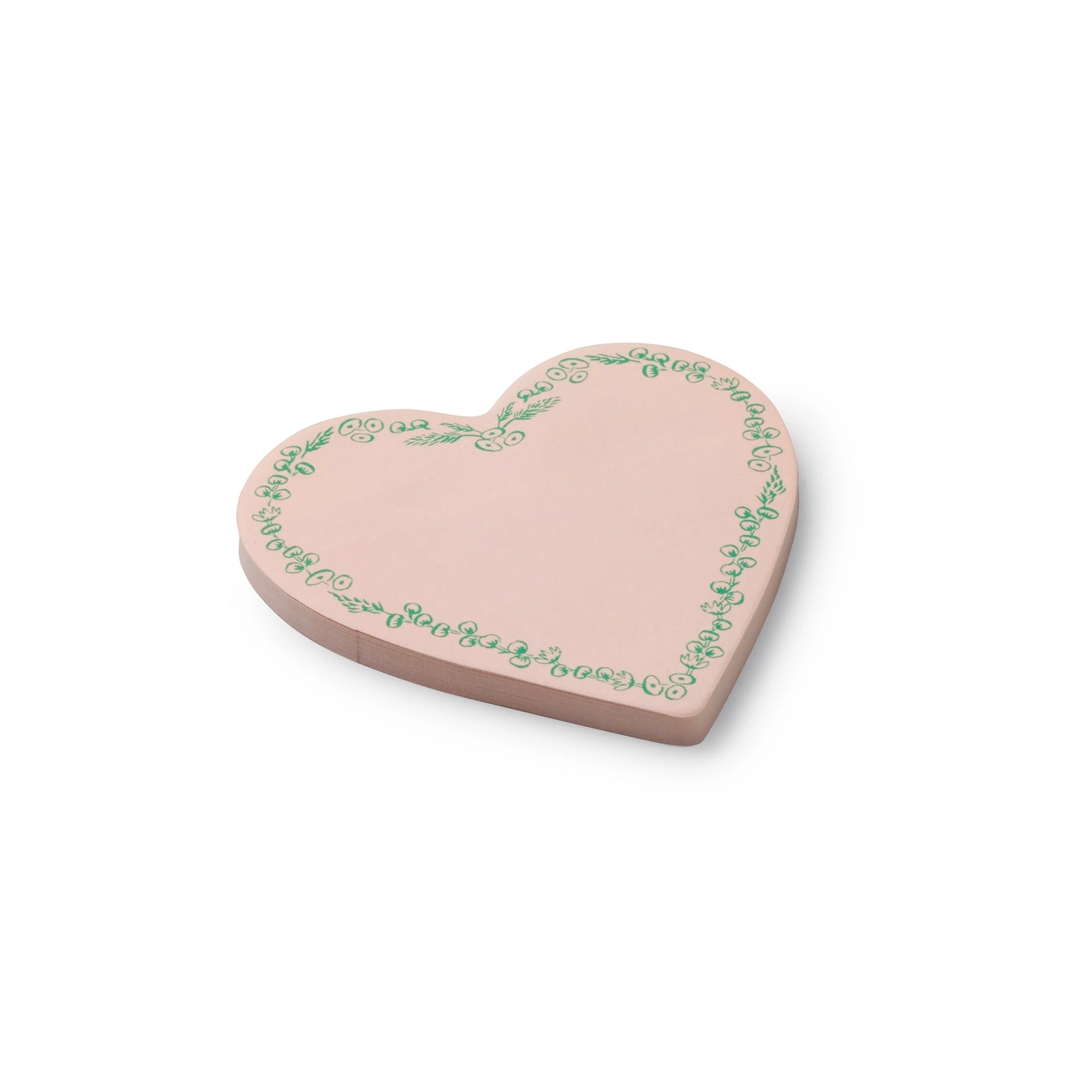 Heart-shaped pink ceramic plate with green floral patterns on a white background