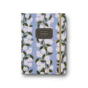 Journal with floral design on a blue background