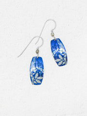 Pair of blue patterned earrings on a white background