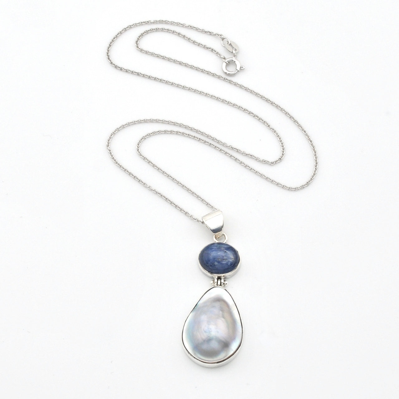 Necklace with a teardrop-shaped pendant featuring a blue stone on a white background
