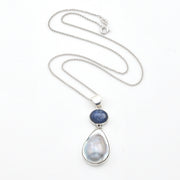 Necklace with a teardrop-shaped pendant featuring a blue stone on a white background