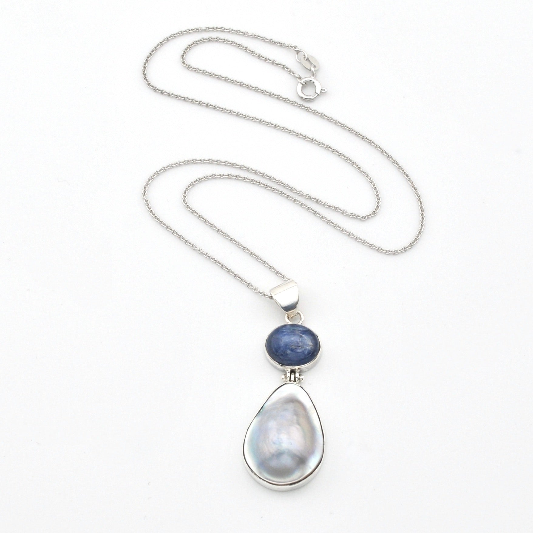 Necklace with a teardrop-shaped pendant featuring a blue stone on a white background