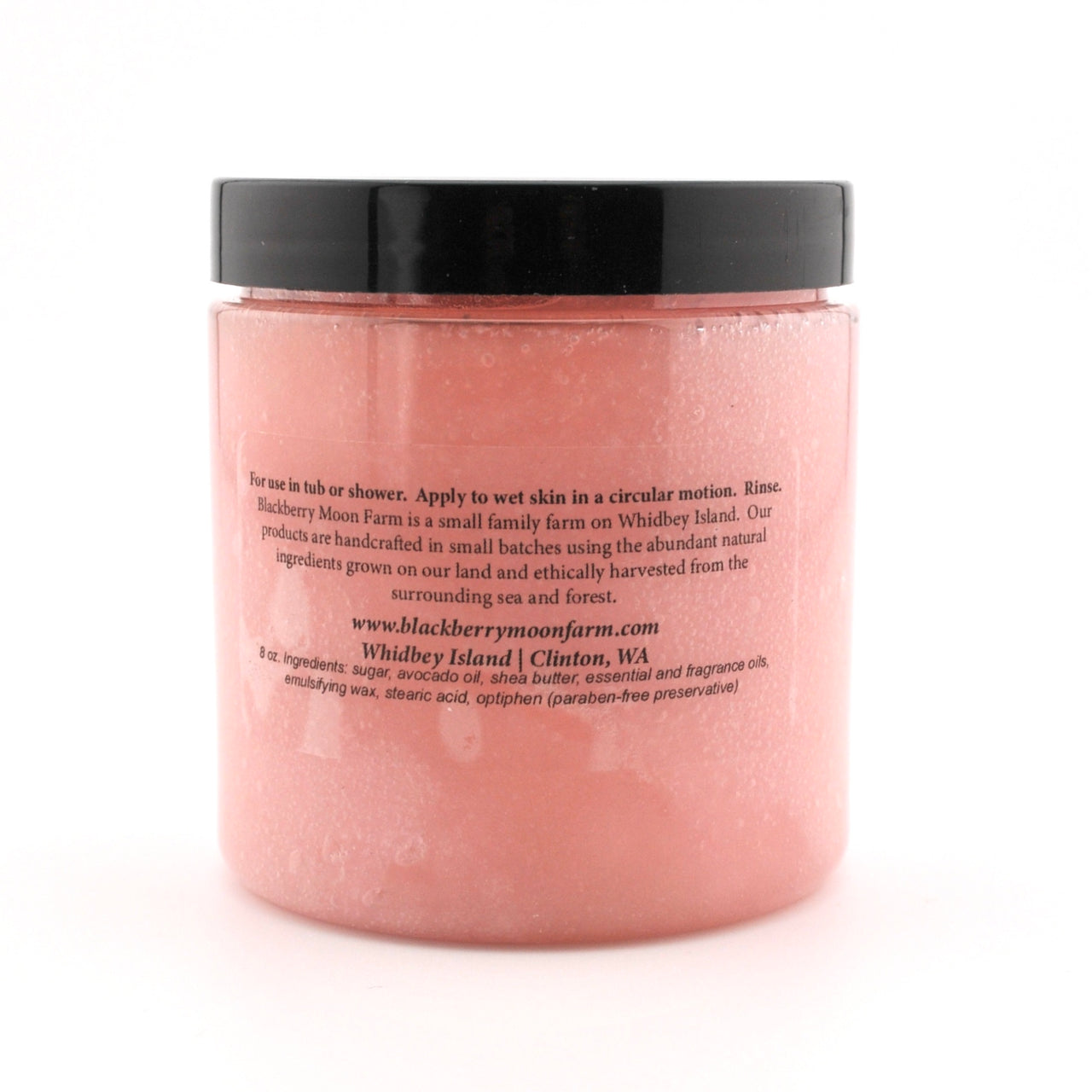 Pink jar with black lid on a white background