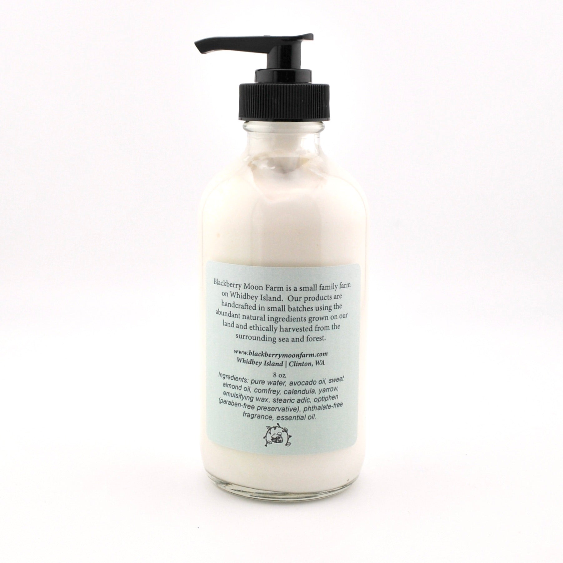 Bottle of cream with a pump on a white background