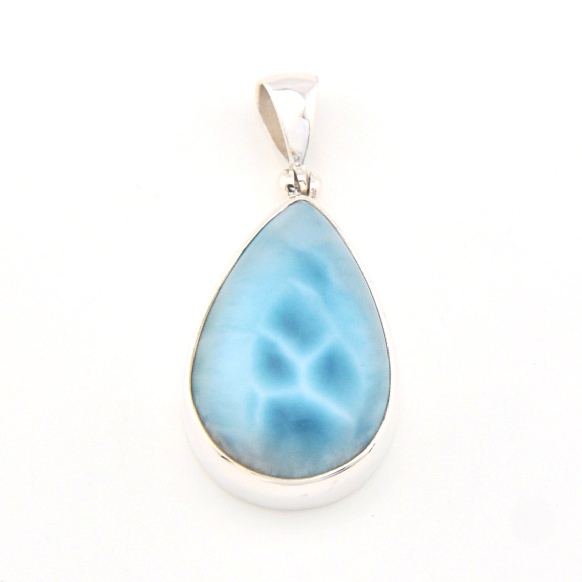 Teardrop-shaped blue pendant on a white background