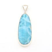 Blue larimar pendant with silver setting on a white background