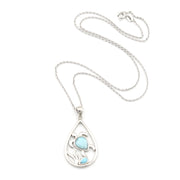 Sea Turtle Pendant with larimar on white background.