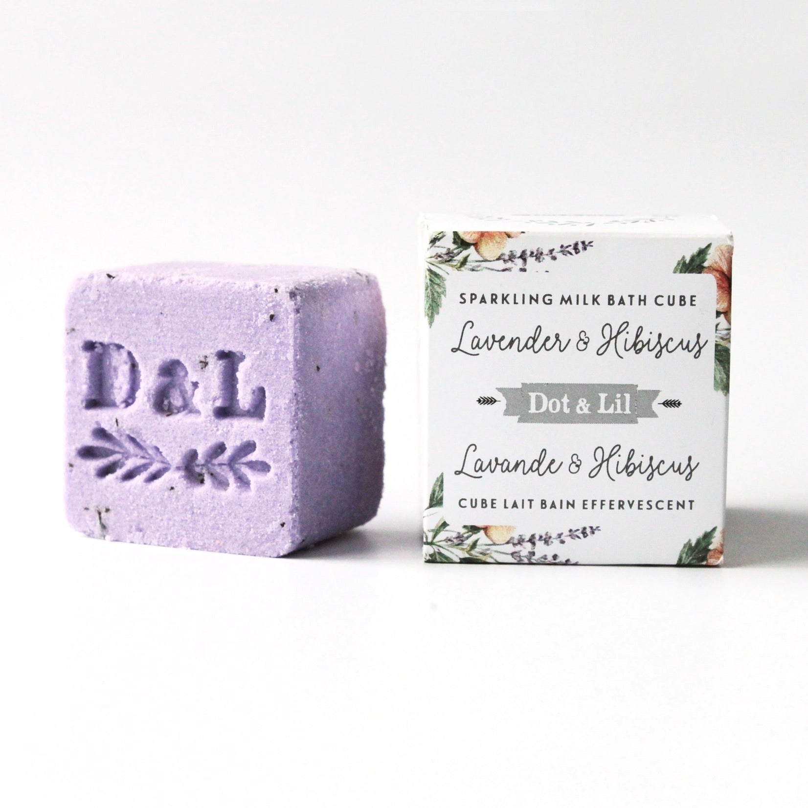 Purple bath cube with 'D&L' branding next to its packaging on a white background