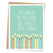 Greeting card with birthday candles and text on a light green background
