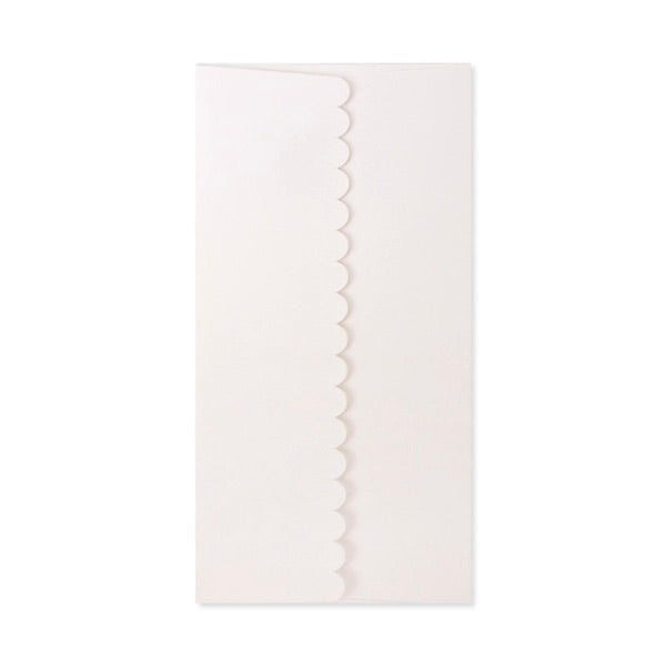 White scalloped edge napkin on a white background