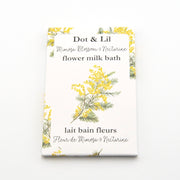 Dot & Lil flower milk bath packaging with floral design on a white background