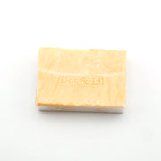 Bar of soap with 'Dot & Lil' branding on a white background