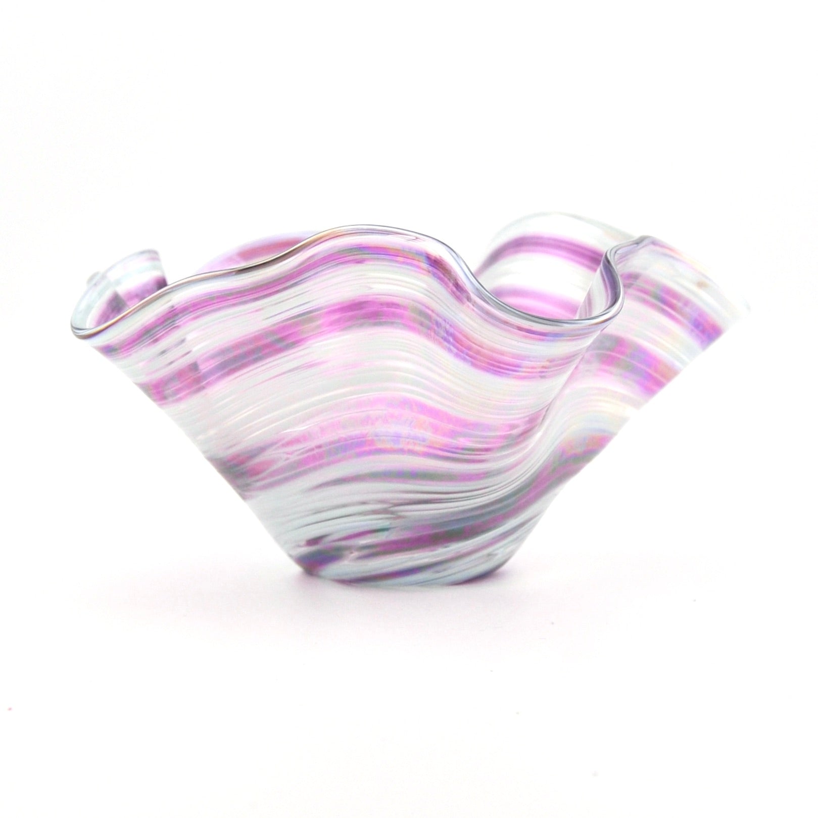 Glass bowl with purple and white swirl pattern on a white background