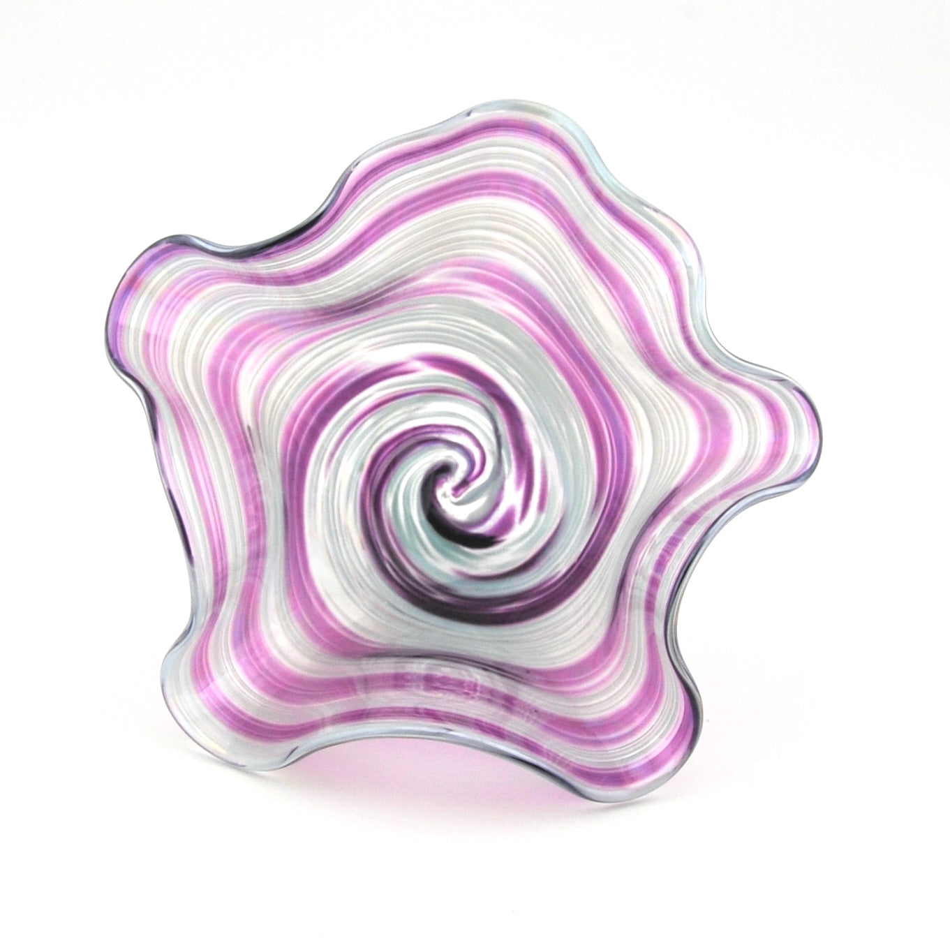Decorative glass piece with wavy, multicolored pattern on a white background