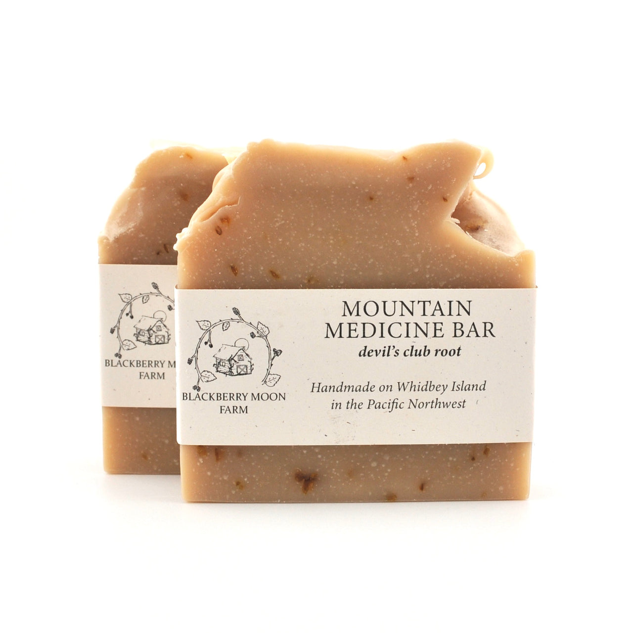 Two soap bars with labels on a white background