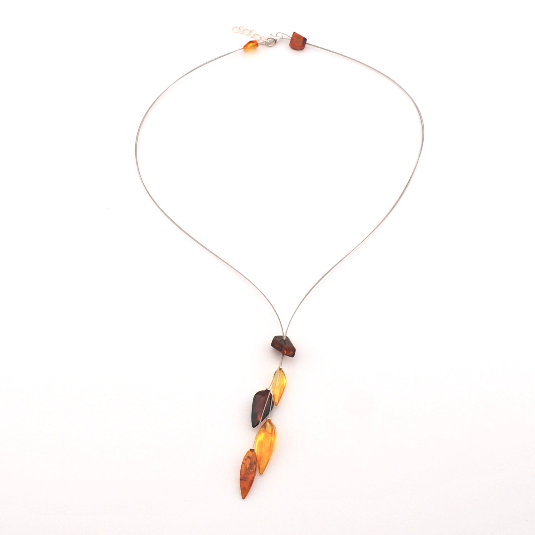 Necklace with amber-colored beads on a white background