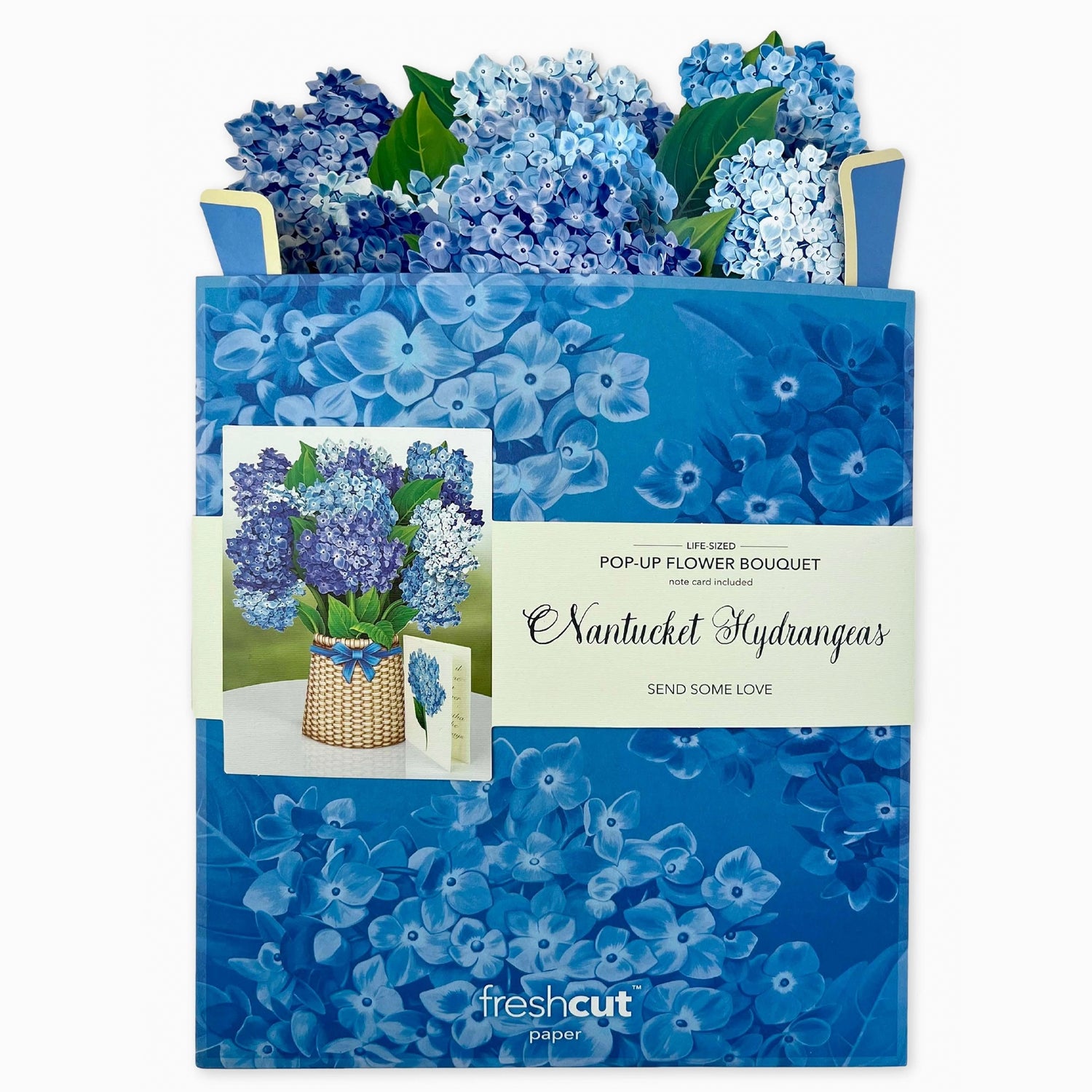 Blue floral pop-up bouquet with packaging and card on a white background