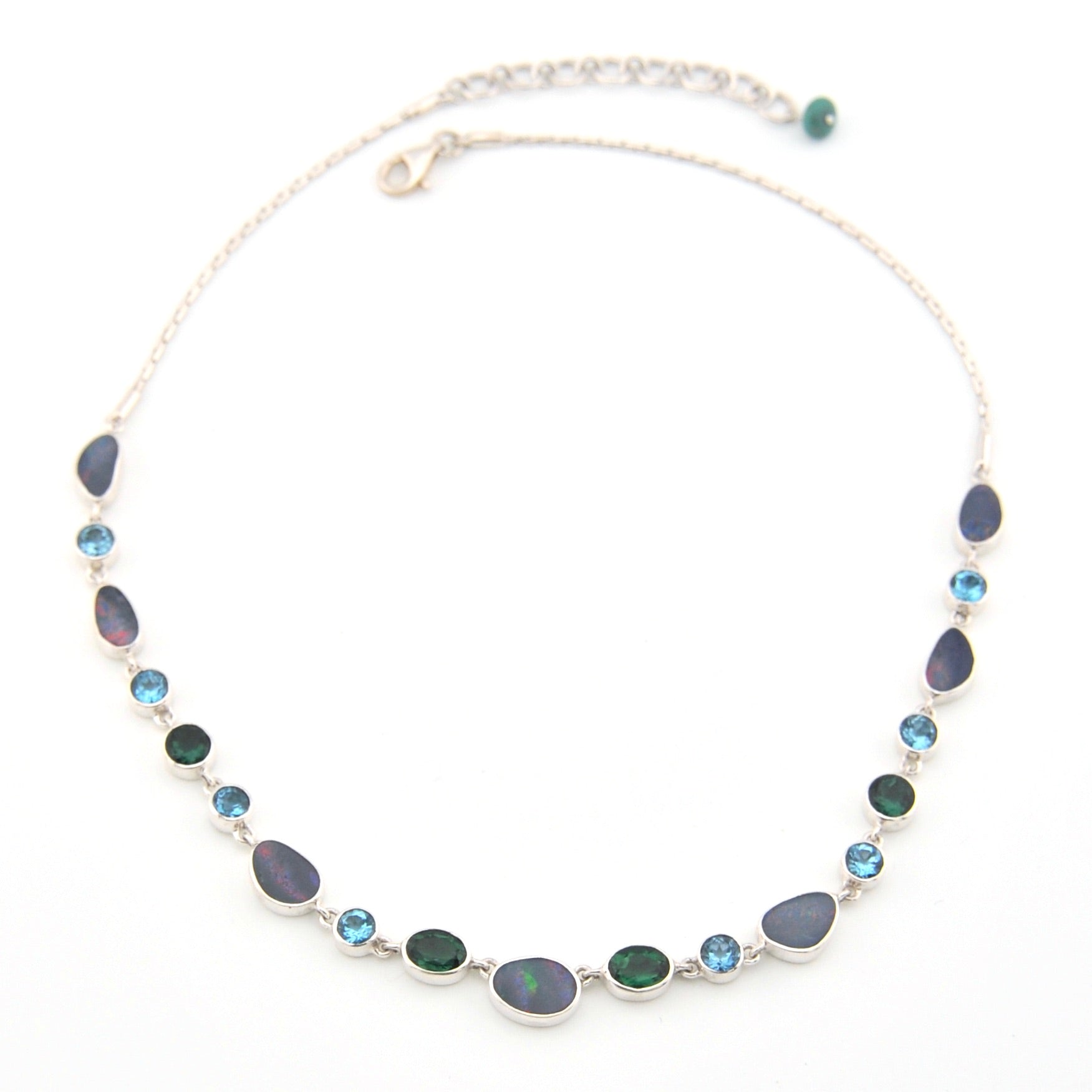 Necklace with blue and green beads on a white background