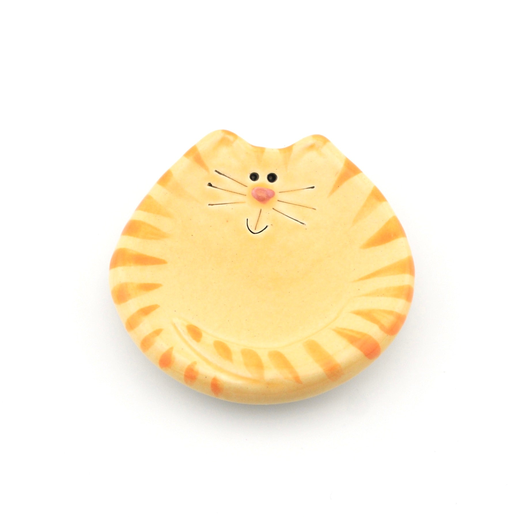 Cat-shaped yellow and orange striped dish on a white background